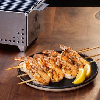 Sapporo beer served with robata grilled shrimp and wasabi soy butter